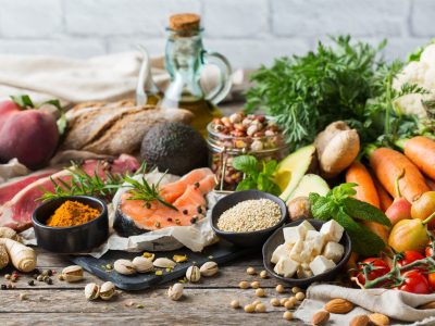Balanced nutrition concept for clean eating flexitarian meditteranean diet. Assortment of healthy food ingredients for cooking on a wooden kitchen table.